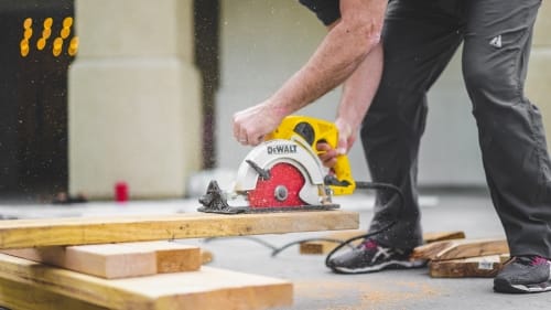 Construction worker with circular saw | Surety bonds & Workers Comp Insurance for Florida